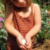 Little girl holding an egg