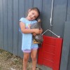 Girl holding Barred Plymouth Rock Chicken