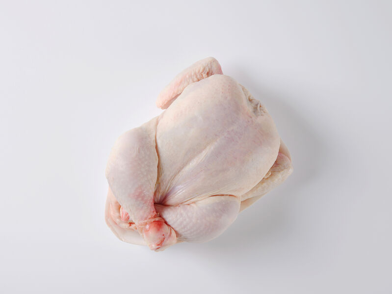 overhead view or raw whole chicken